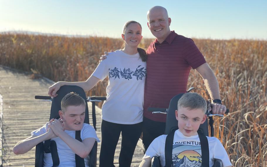 U.S. Air Force Master Sgt. Jared Graham, a member of the 75th Logistics Readiness Squadron at Hill Air Force Base, Utah, and wife Laura pose with sons Dino and Tyson in their new all-terrain wheelchairs in 2021. The Grahams received a special needs grant offered by the Air Force Aid Society to purchase the adventurous wheels for their sons, enabling them to enjoy the outdoors as a family.