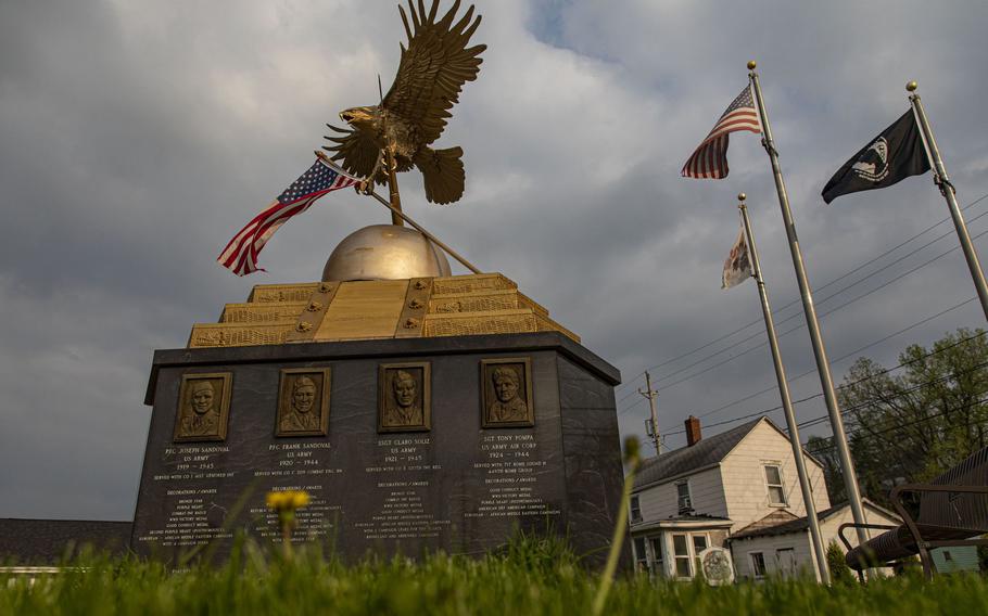 A memorial depicts the eight residents who died serving in World War II and the Korean War on Hero Street in Silvis, Ill.