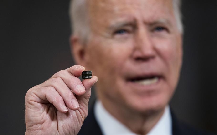President Joe Biden holds a semiconductor during his remarks before signing an executive order on the economy in the State Dining Room of the White House in Washington, D.C., on Feb. 24, 2021. On March 2, 2023, the Biden administration released a compliance note aimed at cracking down on intermediaries used to evade sanctions and export controls on Russia. 