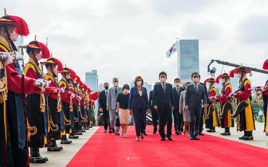 U.S. House Speaker Nancy Pelosi and other U.S. lawmakers greet members of the South Korean honor guard in Seoul, in this photo released on the speaker’s Twitter account, Thursday, Aug. 4, 2022. 