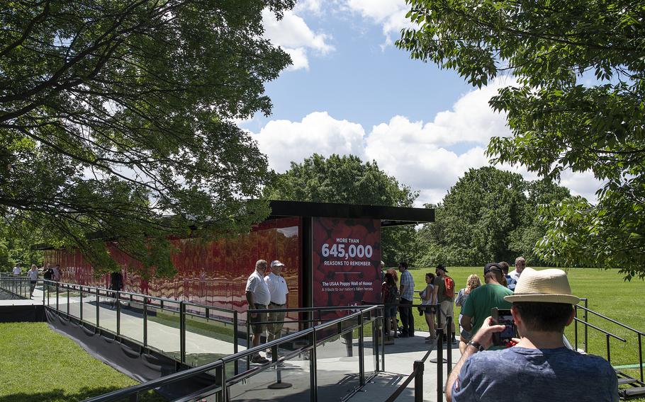 Visitors arrive at the USAA Poppy Wall of Honor on Saturday, May 28, 2022, in Washington, D.C.