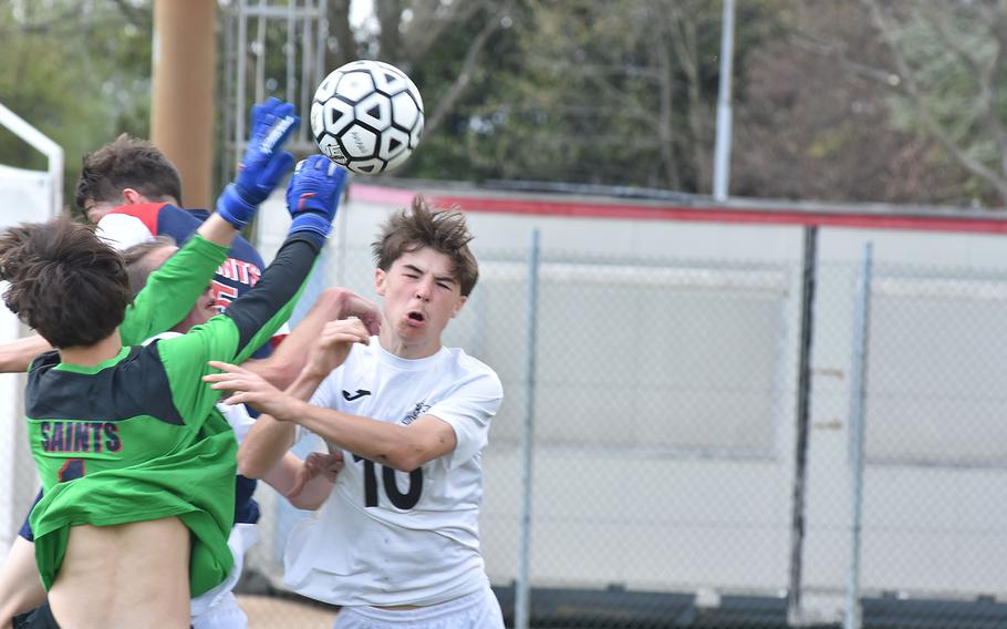 Naples’ Connor Wallace, Aviano goalkeeper Charles Udall and several other players collide in front of the Aviano goal in the Wildcats’ 3-2 victory over the Saints on Saturday, April 16, 2022 in Aviano, Italy.