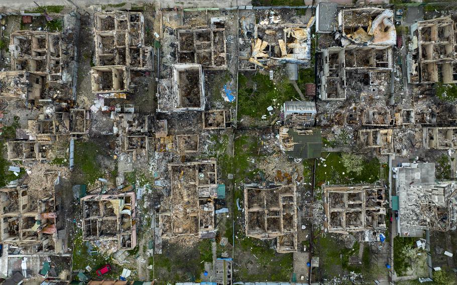 Destroyed houses are photographed in Irpin, on the outskirts of Kyiv, Ukraine, on Saturday, April 30, 2022.