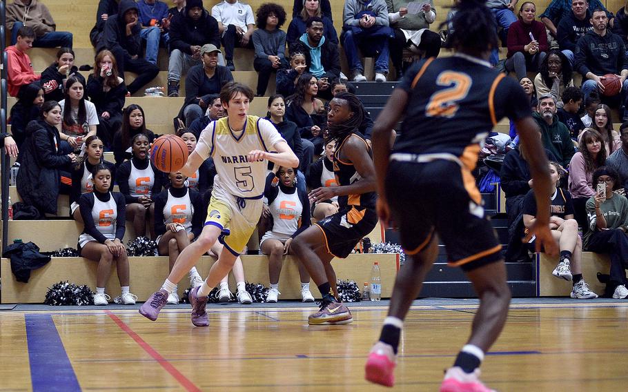 Wiesbaden's Thomas Mann drives the baseline during a game against Spangdahlem on Jan. 19, 2024, at Wiesbaden High School in Wiesbaden, Germany.