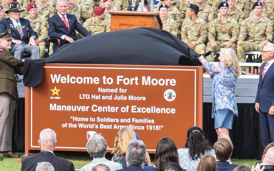 Army Maj. Gen. Curtis Buzzard, the commander of the Maneuver Center of Excellence, and Julie Moore Orlowski, Hal and Julia Moore’s daughter, unveil the new welcome sign for Fort Moore, Ga., during a ceremony Thursday, May 11, 2023, to mark the name change of Fort Benning. 