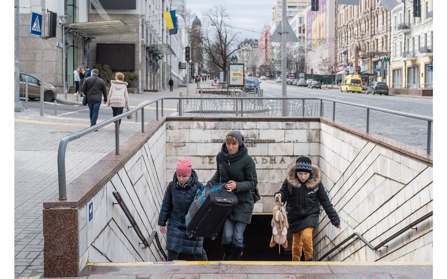 People exit the Teatralna subway station in downtown Kyiv. Many are feeling more secure now that Russian forces have pulled away from the capital. 