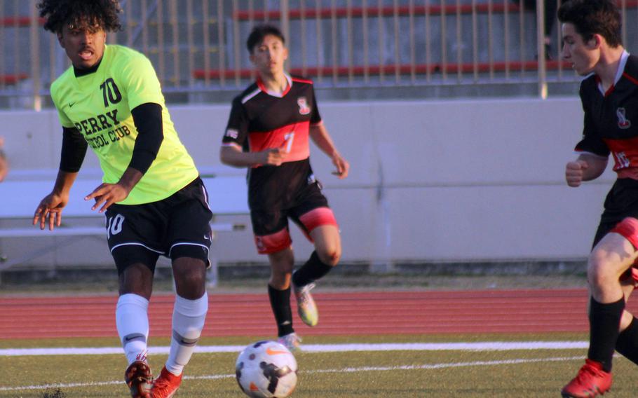 Matthew C. Perry's Denzel Gray boots the ball against E.J. King during Friday's DODEA-Japan soccer match. The Samurai won 5-0.