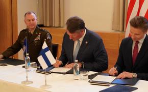 The Virginia National Guard formalized its partnership with the Finnish military during a signing ceremony May 2, 2024, in Helsinki, Finland. The letter of intent, signed by Virginia Governor Glenn Youngkin,, center, Finnish defense minister Antti Häkkänen, and Maj. Gen. James W. Ring, the adjutant general of Virginia, recognizes the pairing as part of the National Guard Bureau's State Partnership Program.