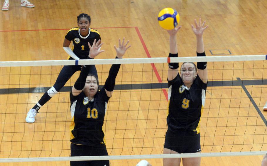 Jenna Cook plays at the net.