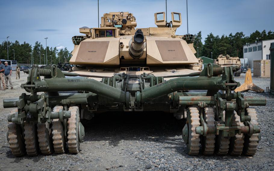 An M1A1 Abrams tank with an attached mine roller at Grafenwoehr Training Area, Germany, on July 14, 2023. Ukrainian soldiers will get extra training on the tanks in Germany, the U.S. military said Thursday.