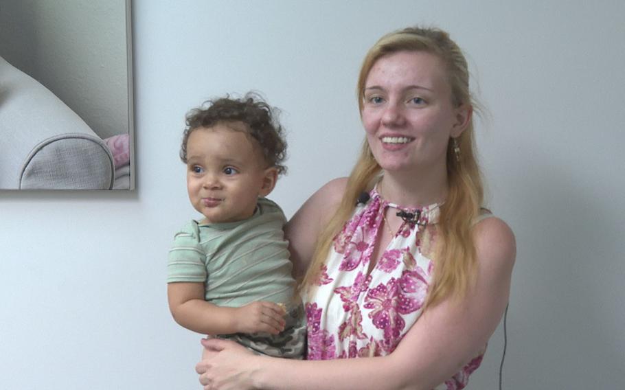 Grace Wolford, an Army spouse with her son Azreal, speaks Aug. 23, 2023, at the opening of the Fort Cavazos Milk Depot about how donating breast milk has help her through postpartum depression and helped support infants in need.