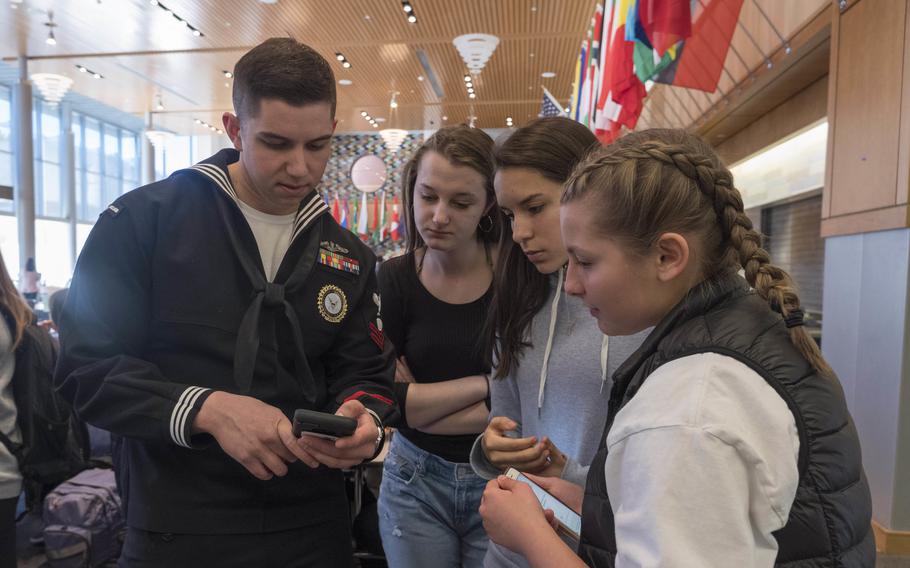 Petty Officer 2nd Class Peter Dicola, a recruiter, speaks to students at Wayland High School in Boston during a scheduled visit in 2019. A group of senators has introduced legislation that allows recruiters greater access to high schools and colleges. 