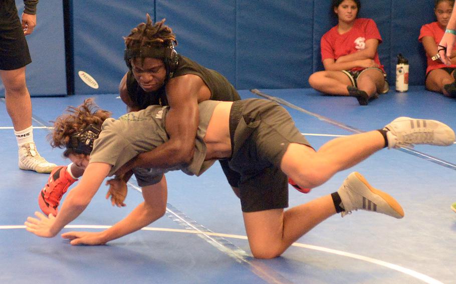 Junior Godfrey Wray, top, may be a wrestler to watch for at 148 pounds for reigning Far East Division I individual and team champion Kubasaki.