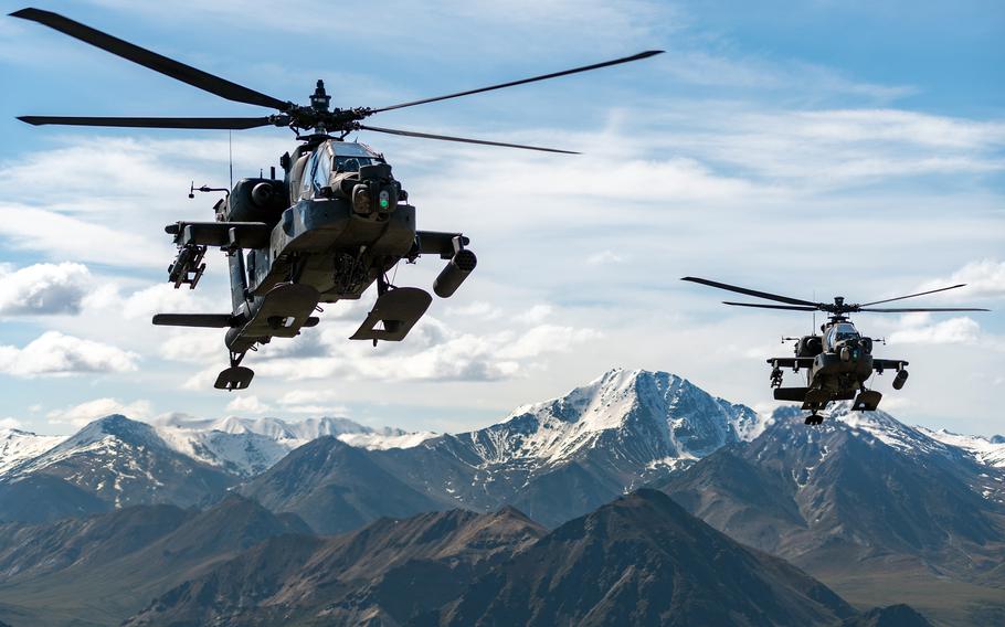 U.S. Army AH-64 Apache attack helicopters assigned to the 1st Battalion, 25th Aviation Regiment fly over an Alaskan mountain range near Fort Wainwright, June 3, 2019.