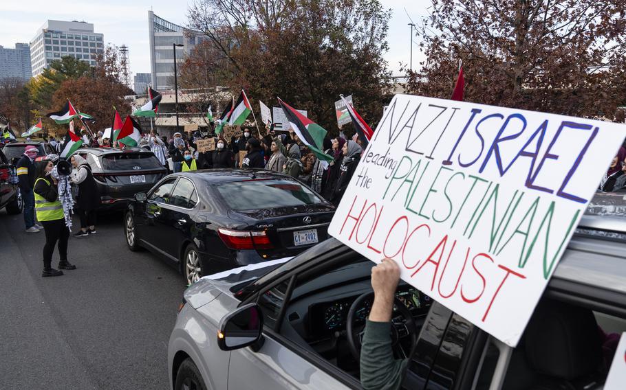 A demonstrator holds a sign during a rally near Tysons Corner Center in Virginia in November. 