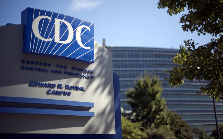 A large sign above the entrance to a building reads “CDC Centers for Disease Control and Prevention Edward R Roybal Campus.: