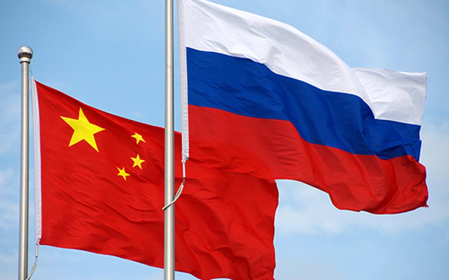 The flags of China and Russia.