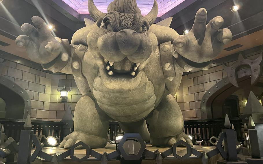 A statue of Bowser welcomes guests to Mario Kart: Koopa’s Challenge inside Super Nintendo World at Universal Studios Japan. 