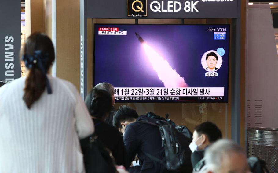 People watch a TV at the Seoul, South Korea, Railway Station on Sept. 15, 2021, showing a file image of a North Korean missile launch. 