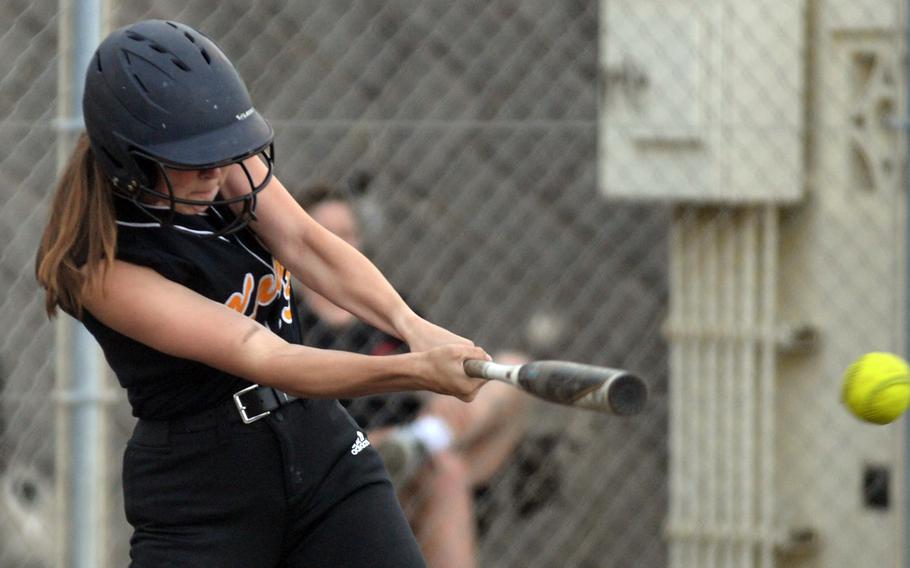 Kadena's Morgan Sayers belts an RBI single against Kubasaki during Tuesday's Okinawa softball game. The Panthers won 19-4.