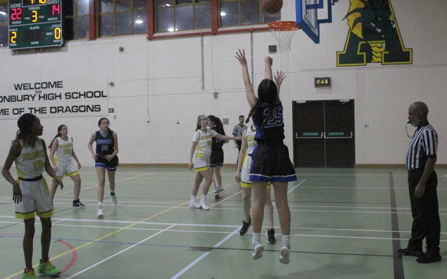 Brussels' Adelaide Duffy-Olivera takes a jump shot Friday, Jan. 20, 2023, at RAF Alconbury, England. Duffy-Olivera was the leading scorer for the Brigands with 16 points. 