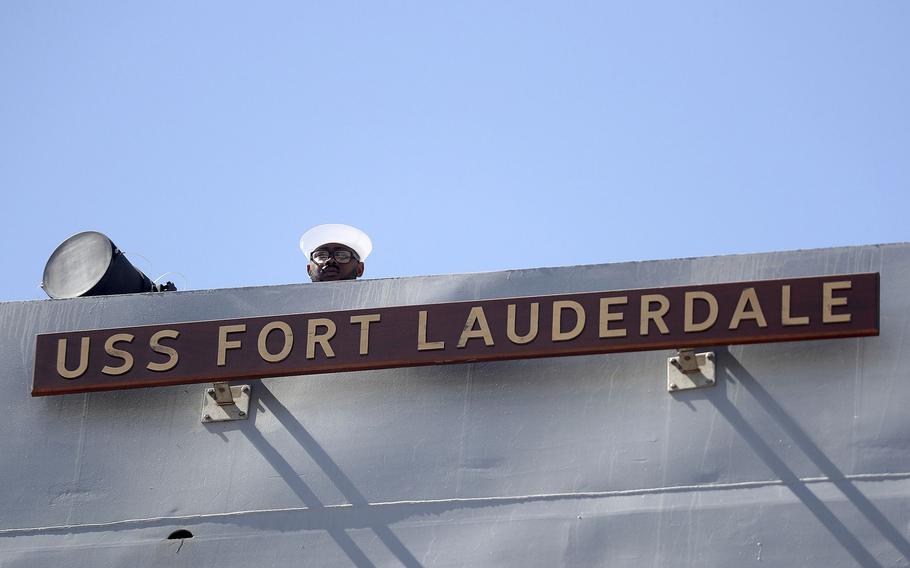 A Sailor stands at attention aboard the USS Fort Lauderdale (LPD 28), a San Antonio-class amphibious transport dock during the commissioning of the ship, on Saturday, July 30, 2022, at Port Everglades in Fort Lauderdale, Florida. 