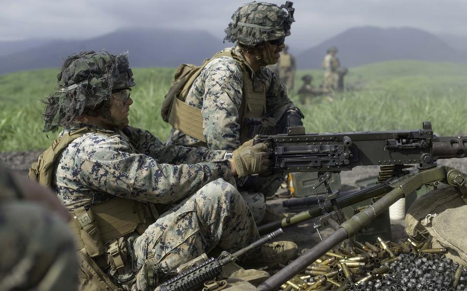 Members of the 2nd Battalion, 2nd Marine Regiment fire a .50-caliber machine gun at Combined Arms Training Center Camp Fuji, Japan, June 24, 2021.