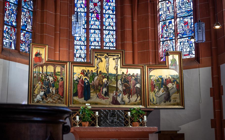 An altarpiece in a chapel with a crucifix .