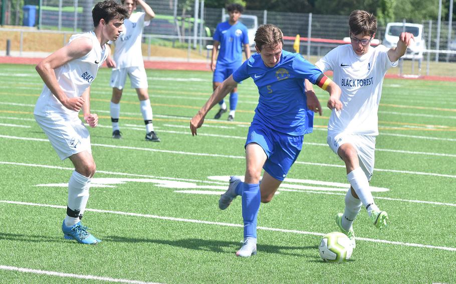Ramstein's Benjamin Brewster and Black Forest Academy's Cooper Swain battle for the ball Wednesday, May 18, 2022, at Ramstein Air Base, Germany in the DODEA-Europe boys Division I semifinals.