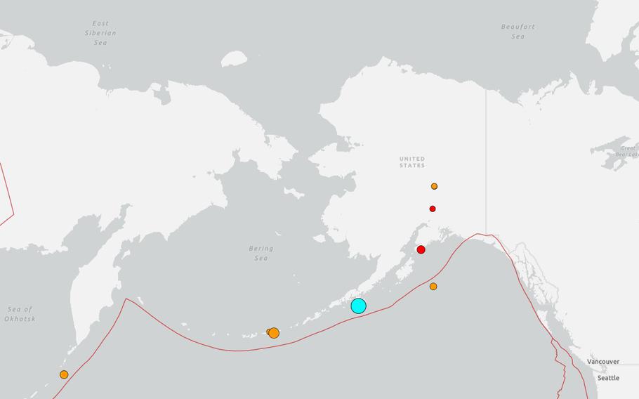 A map of Alaska and the Bering Strait with red, orange and blue dots to mark the locations of earth quakes.