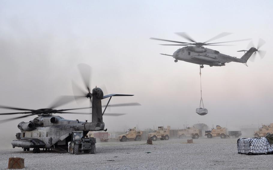 A UH-53 and UH-59 drop off supplies at Forward Operating Base Jackson in Sangin District. Sangin has become a symbol for the insurgency, the Afghan government and the NATO coalition alike, and in recent weeks has become the locus of intense fighting.