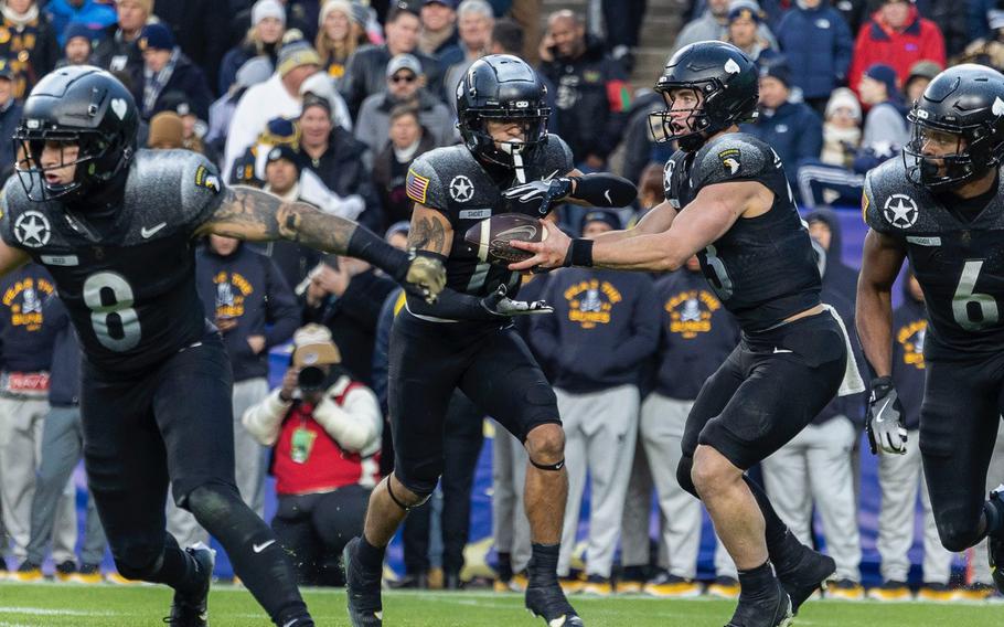 An Army handoff in the backfield.