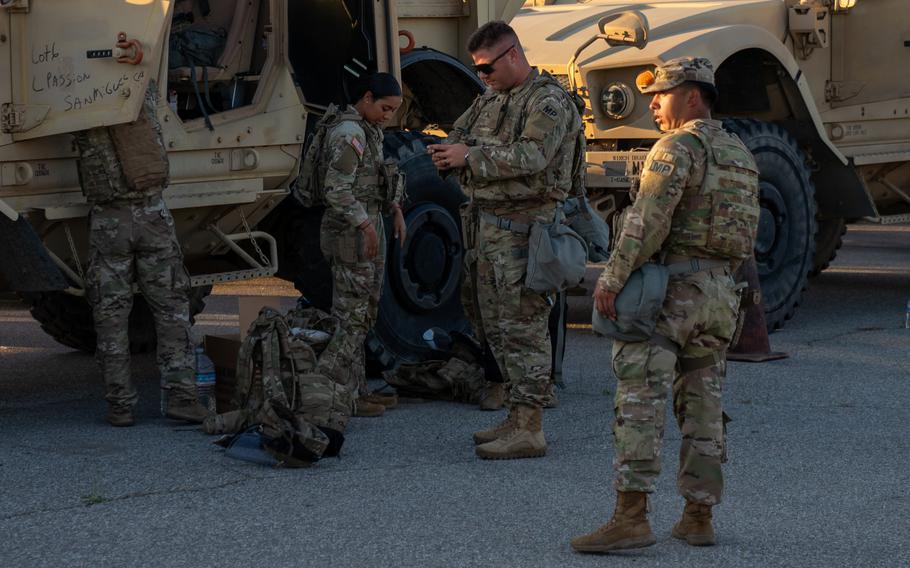 National Guard troops gear up.