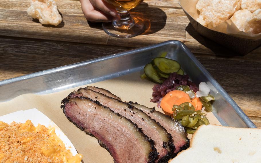 Beers from Hudl Brewing Company and a Texas brisket plate from SoulBelly BBQ, both located in the Arts District in downtown Las Vegas. 