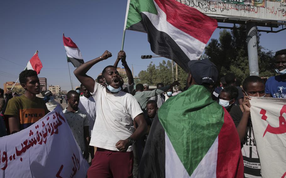 Thousands of protesters take to the streets to renew their demand for a civilian government in the Sudanese capital Khartoum, Thursday, Nov. 25, 2021.