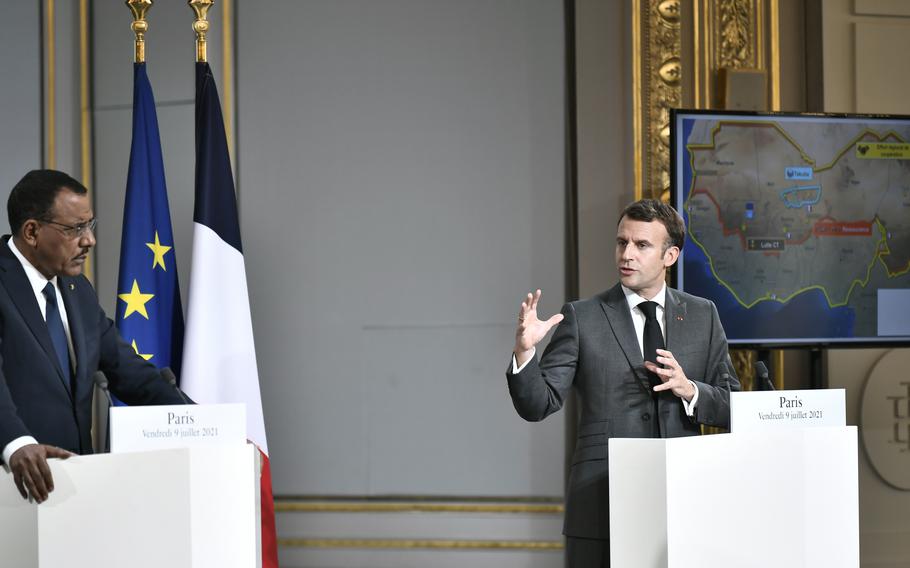 French President Emmanuel Macron, right, and Niger's President Mohamed Bazoum hold a press conference after a video summit with leaders of G5 Sahel countries at the Elysee presidential Palace in Paris, Friday July 9, 2021.