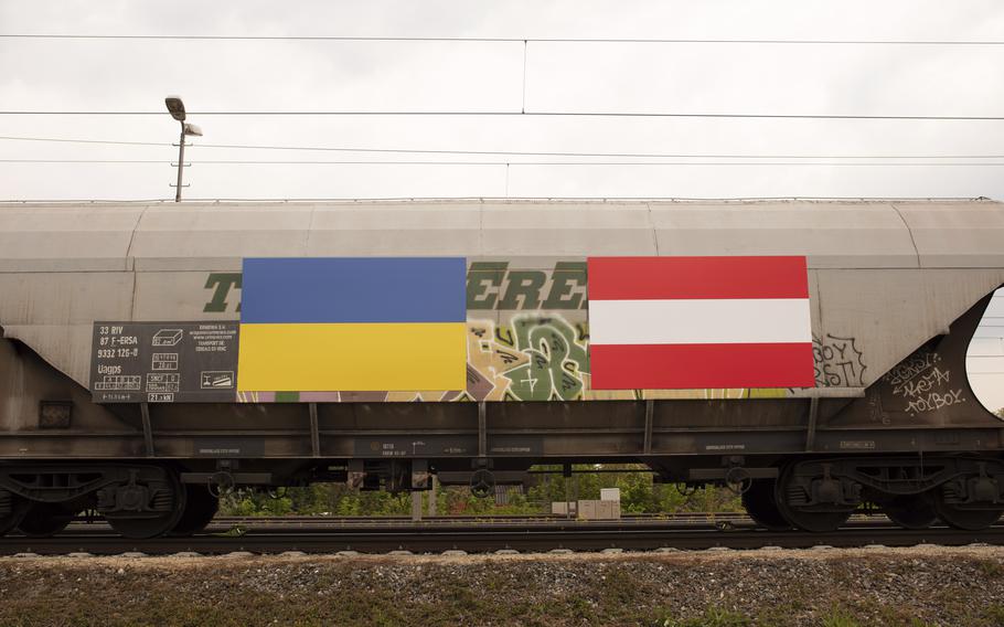 Ukraine and Austria flags are painted on a freight train with fodder maize, arriving from the Ukraine in Vienna, Austria, Friday, May 6, 2022. 