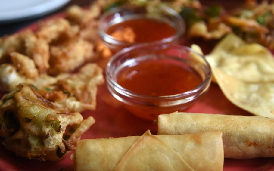 An appetizer plate at Thai Corner in Gruenstadt, Germany, includes spring rolls, fried chicken pieces and vegetable tempura. 