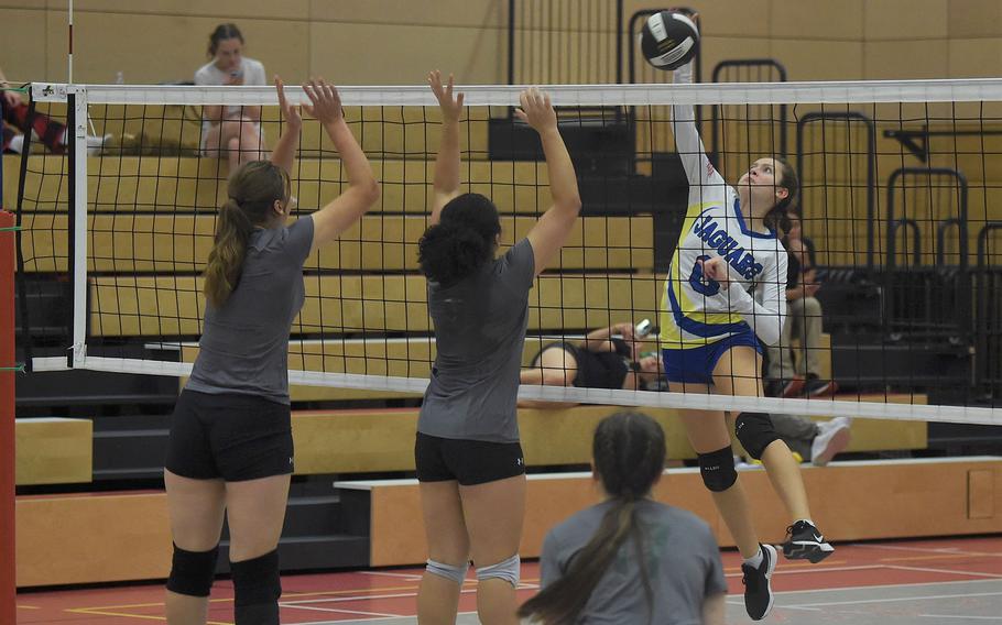 Sigonella’s Anabel Vaiclis spikes the ball into AFNORTH defenders in a semifinal match on Friday, Oct. 28, 2022