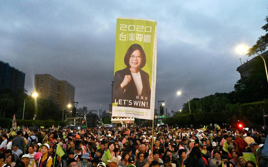 Supporters of Taiwan’s President Tsai Ing-wen display a campaign flag during a campaign rally in Taipei on Jan. 10, 2020. 