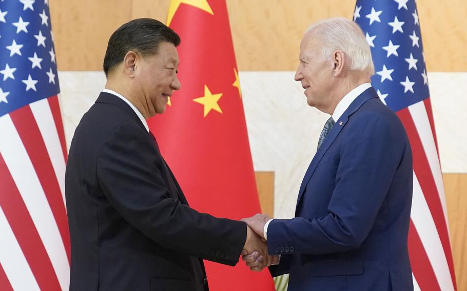 U.S. President Joe Biden and Chinese President Xi Jinping shake hands before their meeting on the sidelines of the G20 summit meeting, Monday, Nov. 14, 2022, in Nusa Dua, in Bali, Indonesia. 