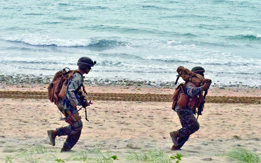 U.S. Marines run along Kings Beach near the Australian town of Bowen during a Talisman Sabre drill, July 22, 2019.