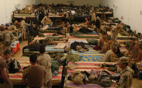 Somewhere in Western Iraq, Sept. 3, 2004: Manchus from 1st Battalion, 9th Infantry Regiment are living in a morgue while they wait to move in to their barracks in Iraq. For the most part, the macabre living conditions didn't bother the troops. 

Read the reactions to the macabre living conditions here.
https://www.stripes.com/migration/manchus-not-bothered-by-macabre-temporary-quarters-in-iraq-1.24005

META TAGS: Operation Iraqi Freedom; morgue; military life; armor; humvee; 1st battalion, 9th Infantry Regiment, 2nd Infantry Division; 2nd Brigade Combat Team; BCT; Manchus; 