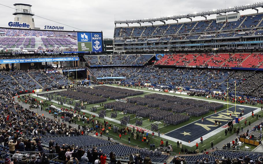Army Cadets stand at attention on the field before an NCAA football game between the Navy Midshipmen and the Army Black Knights at Gillette Stadium Saturday, Dec. 9, 2023, in Foxborough, Mass.