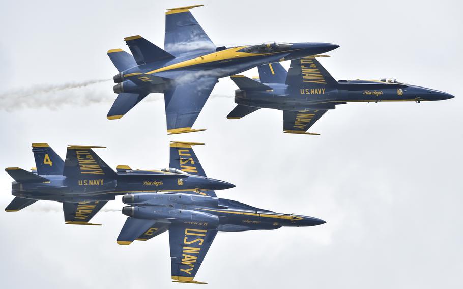 The U.S. Navy Flight Demonstration Squadron, the Blue Angels, Diamond pilots perform the Low Break Cross while practicing prior to the 2018 Terre Haute Air Show, Aug.; 16, 2018. The Blue Angels will return to the Terre Haute Air Show, June 1-2, 2024.