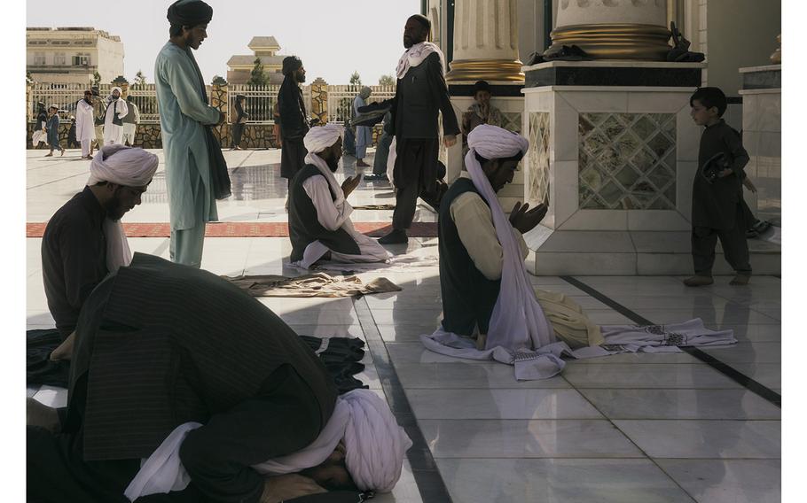 Faithful attend Friday prayer at the central mosque of Kandahar, Afghanistan.