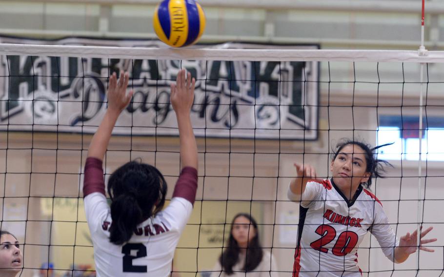 Nile C. Kinnick's Jenia Viles rips a spike past Matthew C. Perry's Aiya Verzosa during Friday's pool-play match in the Ryukyu Island Girls Volleyball Tournament. The teams split their two sets.