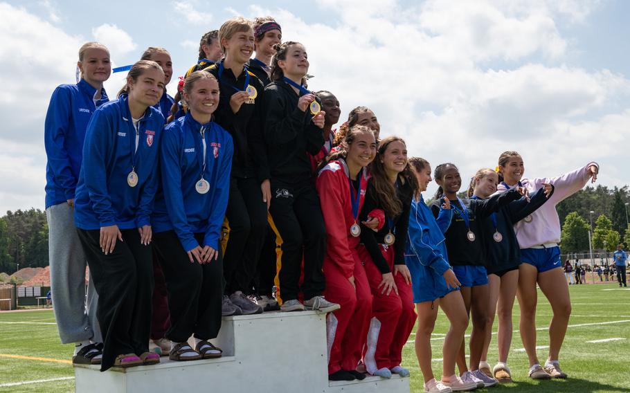 The winning teams of the girls 4x800 meter relay pose with their medals at the 2025 DODEA European Track and Field Championships, May 22, 2025. 1st place Stuttgart High School: Lydia Pound, Anna Konon, Pacha Miletich, Kendall Cancel; 2nd place Ramstein High School: Iliana Echard, Mya Loringer, Rose Thompson, Caroline Swinson; 3rd place Kaiserslautern High School: Alexandra Beck, Hazel Sanders, Mia Rodriguez, Jaiyana Jacobs; 4th place Wiesbaden High School: Clara-Isabel Curtis, Annastasia Berghammer, Emmah Wetherwax, Natalia Bergdorf
