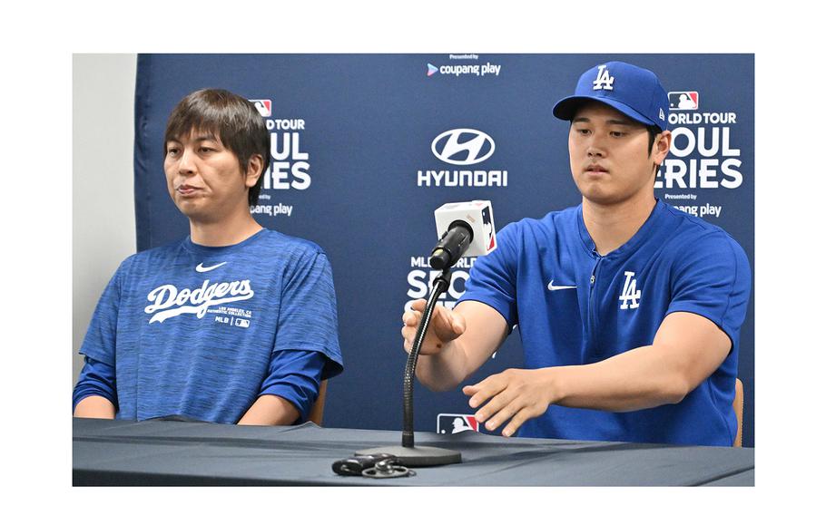 Los Angeles Dodgers’ Shohei Ohtani, right, and his interpreter Ippei Mizuhara attend a press conference at Gocheok Sky Dome in Seoul on March 16, 2024. 