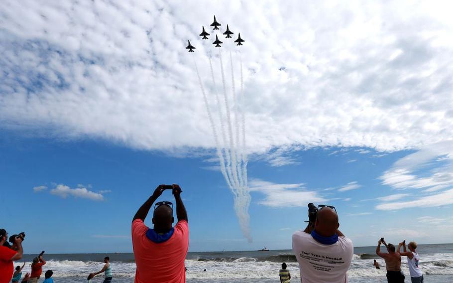Spectators take pictures of the U.S. Air Force Thunderbirds performing during the 2018 Atlantic City Airshow, “Thunder over the Boardwalk,” Wednesday, Aug. 22, 2018.